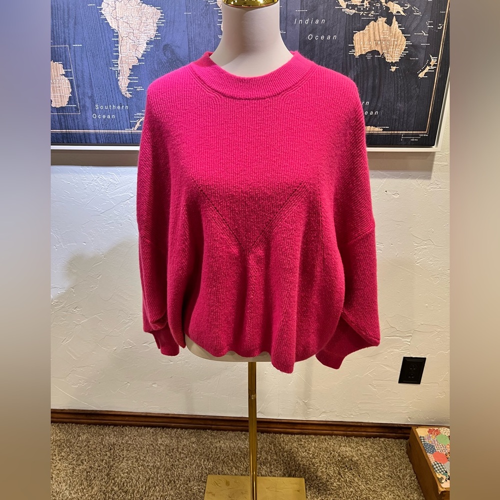 Pink Sweater with oversized fit. There is not a size tag, but I believe it’s a L